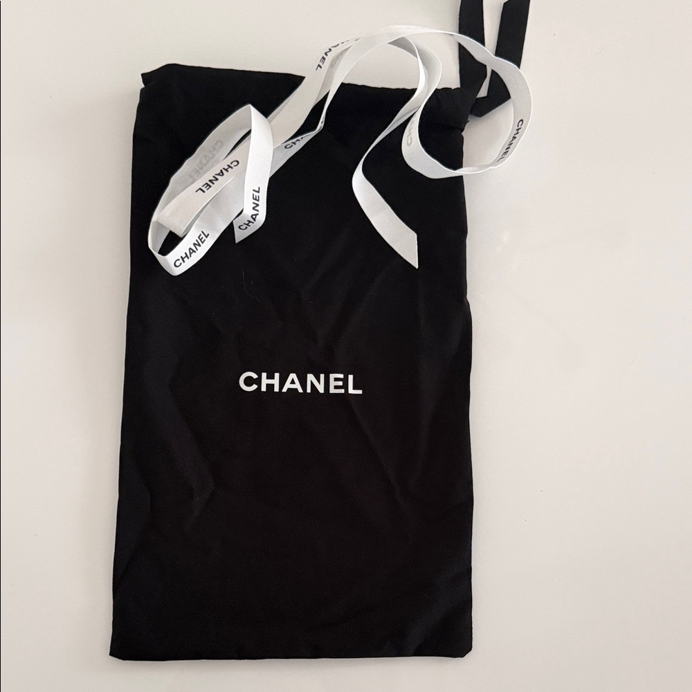 CHANEL Black Cosmetic Bag with White Accents